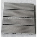 Interlocking composite decking tiles from compound